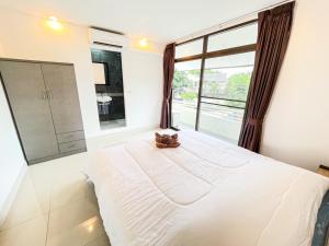 Postel nebo postele na pokoji v ubytování KOUAC VILLA - PATTAYA HOLIDAY HOUSE WALKING STREET 3 bedrooms + 13 fotografií
