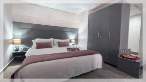 Un ou plusieurs lits dans un hébergement de l'établissement Hotel Al Massira