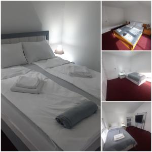 Un dormitorio con una gran cama blanca y una mesa en AQUA VET en Velika Kladuša