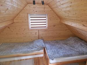 Postel nebo postele na pokoji v ubytování Agroturystyka Skoszewo