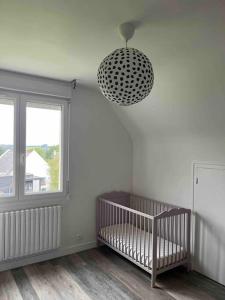 Postel nebo postele na pokoji v ubytování Maison au calme à Dirinon