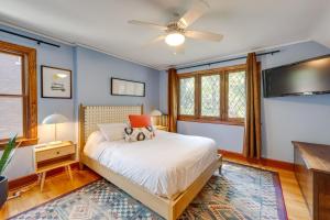 a bedroom with a bed and a flat screen tv at Ferndale Gem, Walk to Stores and Restaurants! in Ferndale