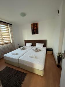 מיטה או מיטות בחדר ב-Къща за гости "Холидей - Луковит"