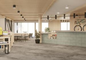 a large room with a table and a dining room at Field Station Joshua Tree in Yucca Valley