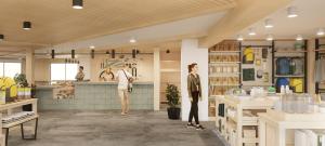a rendering of a store with two people standing in the kitchen at Field Station Joshua Tree in Yucca Valley