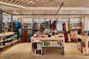 a store filled with lots of racks of clothes at Field Station Joshua Tree in Yucca Valley