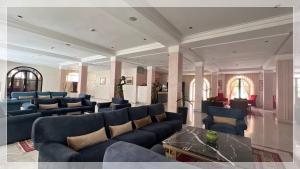 Coin salon dans l'établissement Hotel Al Massira