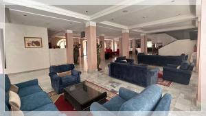 Coin salon dans l'établissement Hotel Al Massira