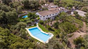 an aerial view of a house with a swimming pool at Cortijo Huerta Dorotea in Prado del Rey