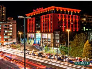 a busy city street with cars in front of a building at 3 Floor Townhouse Luxury Living Alara Boutique in Birmingham
