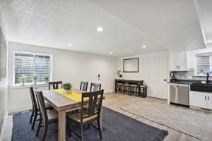 a kitchen and dining room with a table and chairs at Family-Friendly Provo Vacation Rental Near BYU! in Provo