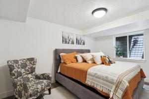 a bedroom with a bed and a chair at Family-Friendly Provo Vacation Rental Near BYU! in Provo