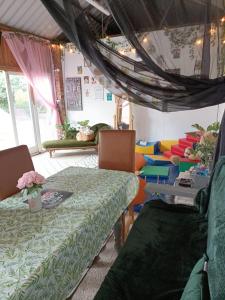 a room with two beds and a table and chairs at The White Dove Bed and Breakfast and Bell Tents 1 in Newark upon Trent