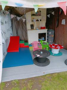 a play tent with a table and chairs in it at The White Dove Bed and Breakfast and Bell Tents 1 in Newark upon Trent