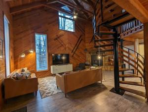an office with a staircase in a wooden building at Base Camp in Cortland