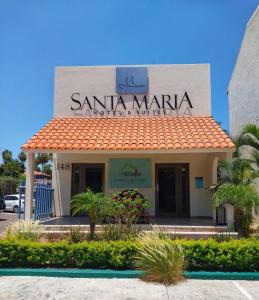 Um edifício de Santa Margarita com um cartaz. em Zona Hotelera San José del Cabo em San José del Cabo