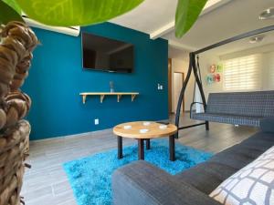 a living room with a couch and a table at SM Apartments in San José del Cabo