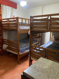 a room with three bunk beds in a room at Gulf Porto Marina Call First in El Alamein