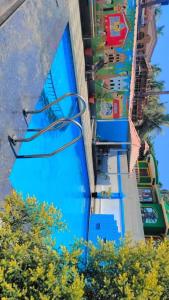 a pool at a theme park with blue water at Blue rays in Calangute