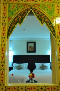 Postel nebo postele na pokoji v ubytování Palais Riad Reda & Spa