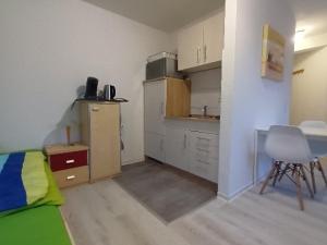 Dapur atau dapur kecil di Voll ausgestattetes Apartment