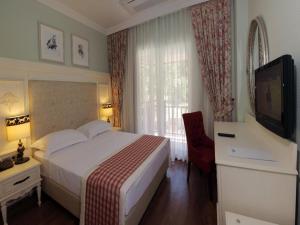 Μια τηλεόραση ή/και κέντρο ψυχαγωγίας στο Padok Premium Hotel & Stables