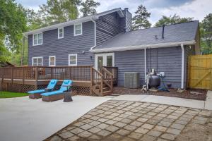 a home with a deck and a house at Lovely Riverdale Retreat with Private Pool and Yard! in Riverdale
