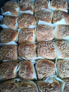 a bunch of pastries with sesame seeds on them at Casa Macianet in Beranui