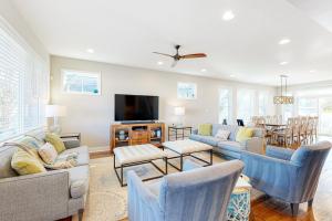a living room with couches and a flat screen tv at Town of Rehoboth Beach 302 Laurel St in Rehoboth Beach