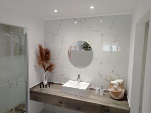 a white bathroom with a sink and a mirror at Maistrali in Provatas +37 photos
