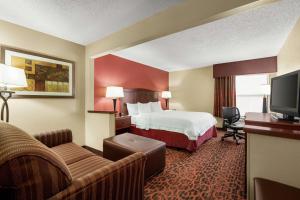 a hotel room with a bed and a tv at Hampton Inn Abilene in Abilene