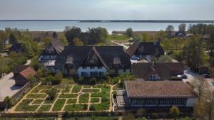 an aerial view of a house with a garden at Hotel Haferland in Wieck