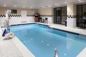 a large swimming pool with blue water at Hilton Garden Inn Atlanta Perimeter Center in Atlanta