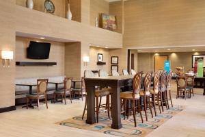a large dining room with a table and chairs at Hampton Inn & Suites Birmingham Airport Area in Birmingham