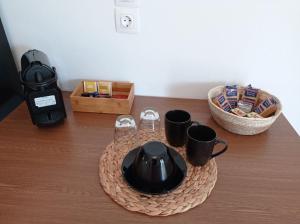 a tea kettle and cups on a tray on a table at Maistrali in Provatas