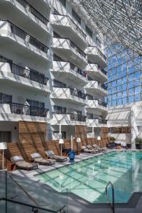 a swimming pool in front of a building at Hilton Boston-Woburn in Woburn