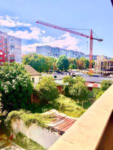 a view of a city with a crane and buildings at City Residence Apartments Sofia in Sofia