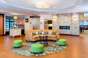 a living room with a couch and a fireplace at Homewood Suites by Hilton Akron/Fairlawn in Akron