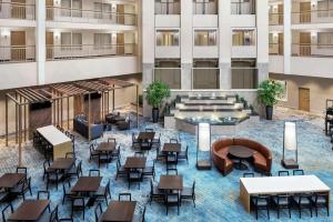 an overhead view of a hotel lobby with tables and chairs at Embassy Suites by Hilton Columbus Dublin in Dublin