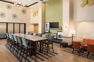 a dining room with a table and chairs at Hampton Inn & Suites Corpus Christi, TX in Corpus Christi