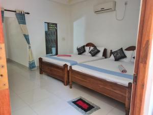 Letto o letti in una camera di Thuruliya Residence