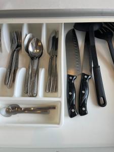 a drawer filled with silver utensils in a drawer at City center residents Pool view in Pattaya
