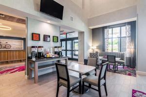 a restaurant with a table and chairs in a room at Hampton Inn & Suites-Dallas/Richardson in Richardson