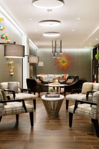 a living room with a couch and a table at Hampton Inn & Suites Dallas Downtown in Dallas