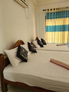 Letto o letti in una camera di Thuruliya Residence