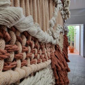 a wall filled with lots of different types of ropes at CASAS de CONSTÂNCIA in Constância