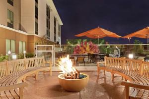 a fire pit in a pot on a patio at Homewood Suites by Hilton Houston NW at Beltway 8 in Houston