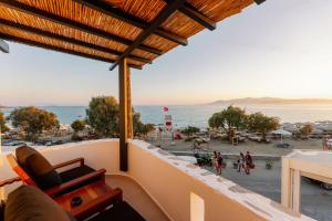 a view of the beach from the balcony of a house at Deep blue suites in Agios Prokopios