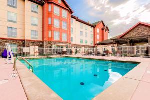a swimming pool in front of a building at Homewood Suites by Hilton Lawton in Lawton