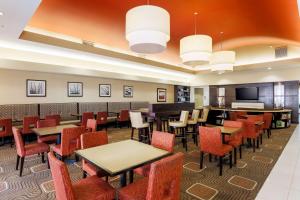 a large dining room with tables and chairs at Homewood Suites by Hilton Lawton in Lawton